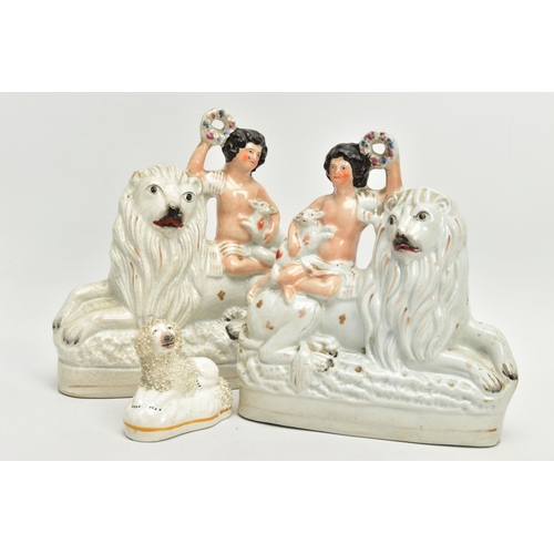 230 - A PAIR OF VICTORIAN STAFFORDSHIRE POTTERY FIGURE GROUPS, modelled as a naked boy holding a garland a... 