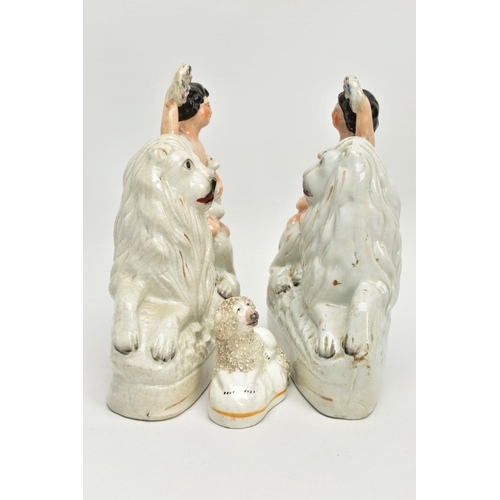 230 - A PAIR OF VICTORIAN STAFFORDSHIRE POTTERY FIGURE GROUPS, modelled as a naked boy holding a garland a... 