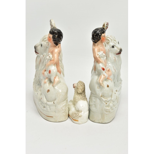 230 - A PAIR OF VICTORIAN STAFFORDSHIRE POTTERY FIGURE GROUPS, modelled as a naked boy holding a garland a... 