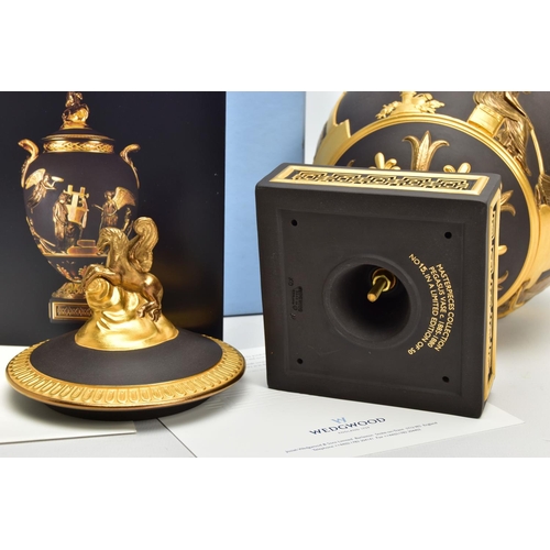 232 - A BOXED WEDGWOOD MASTERPIECE COLLECTION LIMITED EDITION BLACK BASALT AND GILT PEGASUS VASE AND COVER... 