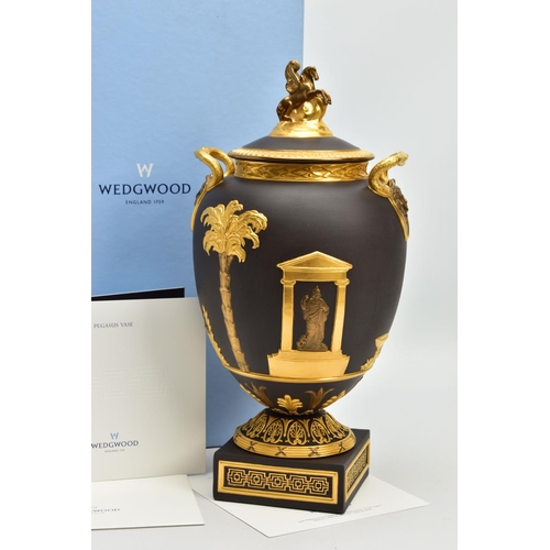 232 - A BOXED WEDGWOOD MASTERPIECE COLLECTION LIMITED EDITION BLACK BASALT AND GILT PEGASUS VASE AND COVER... 