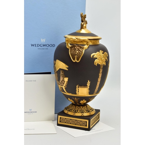 232 - A BOXED WEDGWOOD MASTERPIECE COLLECTION LIMITED EDITION BLACK BASALT AND GILT PEGASUS VASE AND COVER... 