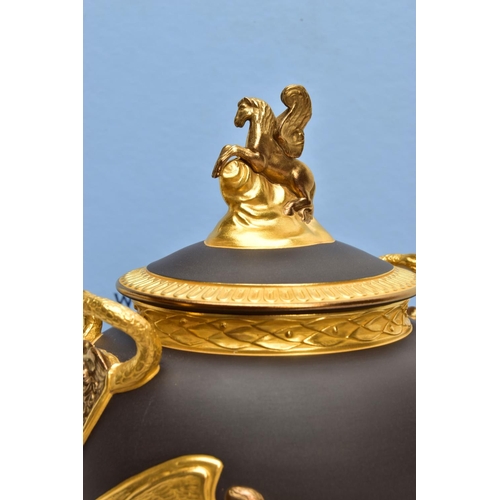 232 - A BOXED WEDGWOOD MASTERPIECE COLLECTION LIMITED EDITION BLACK BASALT AND GILT PEGASUS VASE AND COVER... 