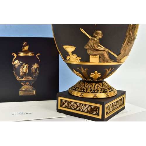 232 - A BOXED WEDGWOOD MASTERPIECE COLLECTION LIMITED EDITION BLACK BASALT AND GILT PEGASUS VASE AND COVER... 