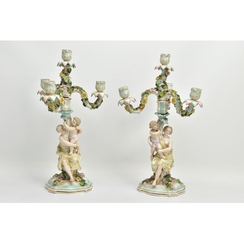 235 - A PAIR OF LATE 19TH / EARLY 20TH CENTURY PLAUE PORCELAIN FLORALLY ENCRUSTED FIGURAL CANDELABRA, each... 