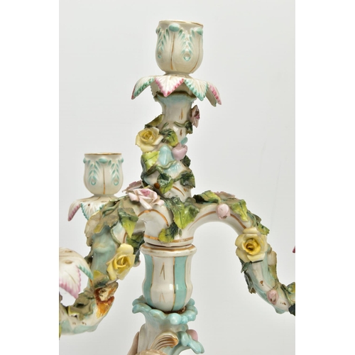 235 - A PAIR OF LATE 19TH / EARLY 20TH CENTURY PLAUE PORCELAIN FLORALLY ENCRUSTED FIGURAL CANDELABRA, each... 