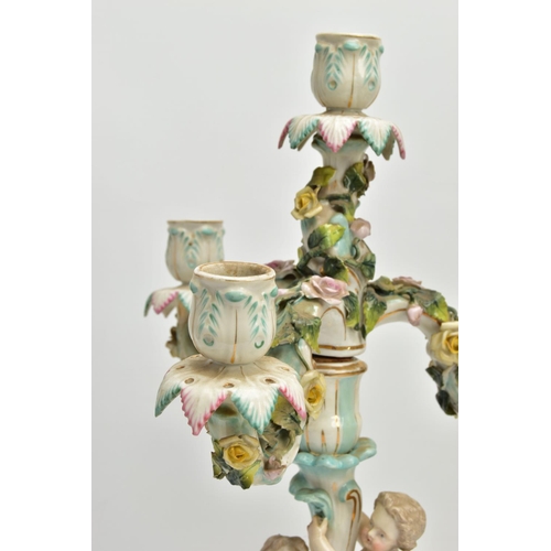 235 - A PAIR OF LATE 19TH / EARLY 20TH CENTURY PLAUE PORCELAIN FLORALLY ENCRUSTED FIGURAL CANDELABRA, each... 