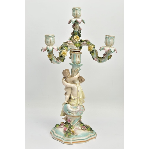 235 - A PAIR OF LATE 19TH / EARLY 20TH CENTURY PLAUE PORCELAIN FLORALLY ENCRUSTED FIGURAL CANDELABRA, each... 