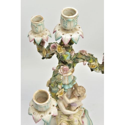 235 - A PAIR OF LATE 19TH / EARLY 20TH CENTURY PLAUE PORCELAIN FLORALLY ENCRUSTED FIGURAL CANDELABRA, each... 