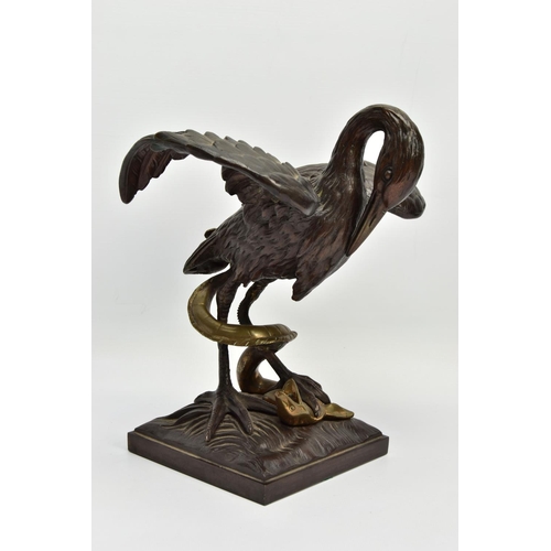 248 - A 19TH CENTURY BRONZE FIGURE OF A STORK STANDING WITH OUTSTRETCHED WINGS, clutching an eel to the gr... 