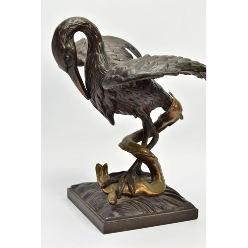 248 - A 19TH CENTURY BRONZE FIGURE OF A STORK STANDING WITH OUTSTRETCHED WINGS, clutching an eel to the gr... 