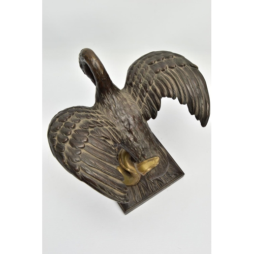 248 - A 19TH CENTURY BRONZE FIGURE OF A STORK STANDING WITH OUTSTRETCHED WINGS, clutching an eel to the gr... 