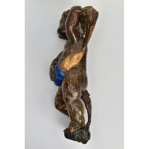 249 - A CARVED WOODEN SUPPORT IN THE FORM OF A PUTTI, with later polychrome decoration and later ebonised ... 