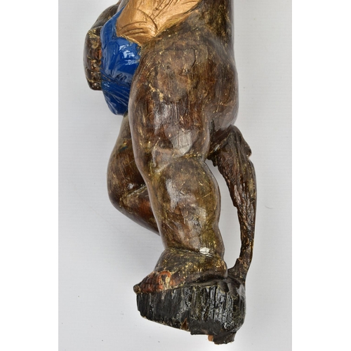 249 - A CARVED WOODEN SUPPORT IN THE FORM OF A PUTTI, with later polychrome decoration and later ebonised ... 