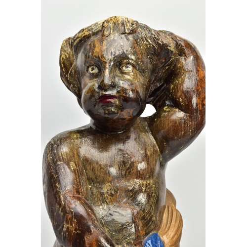 249 - A CARVED WOODEN SUPPORT IN THE FORM OF A PUTTI, with later polychrome decoration and later ebonised ... 