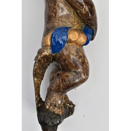 249 - A CARVED WOODEN SUPPORT IN THE FORM OF A PUTTI, with later polychrome decoration and later ebonised ... 