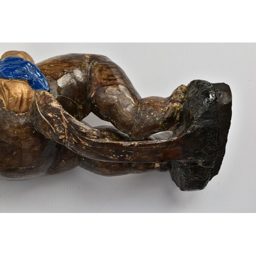 249 - A CARVED WOODEN SUPPORT IN THE FORM OF A PUTTI, with later polychrome decoration and later ebonised ... 