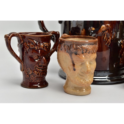 267 - A VICTORIAN TREACLE GLAZED LOVING CUP, decorated in relief with bust of Nelson, fighting dogs and ta... 