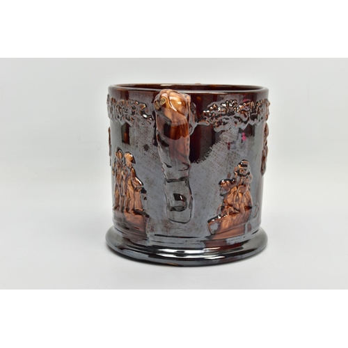 267 - A VICTORIAN TREACLE GLAZED LOVING CUP, decorated in relief with bust of Nelson, fighting dogs and ta... 