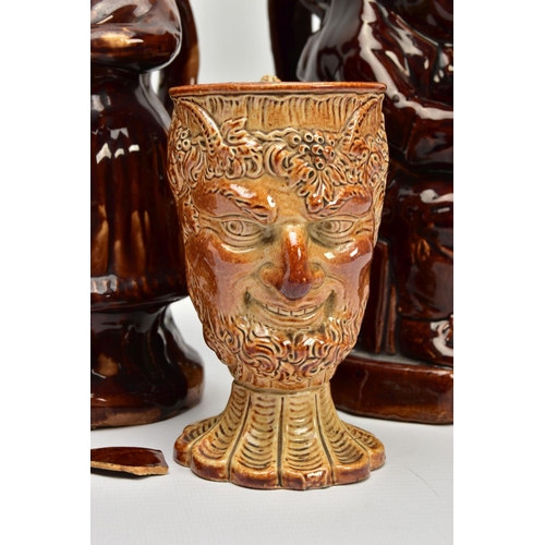 267 - A VICTORIAN TREACLE GLAZED LOVING CUP, decorated in relief with bust of Nelson, fighting dogs and ta... 