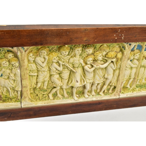 268 - A DELLA ROBBIA THREE SECTION RECTANGULAR PLAQUE MOULDED IN RELIEF WITH A PROCESSION OF CHILDREN THRO... 