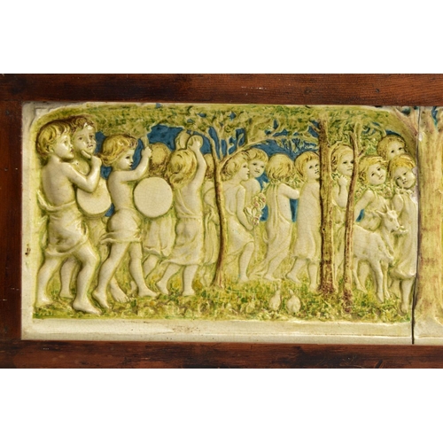 268 - A DELLA ROBBIA THREE SECTION RECTANGULAR PLAQUE MOULDED IN RELIEF WITH A PROCESSION OF CHILDREN THRO... 