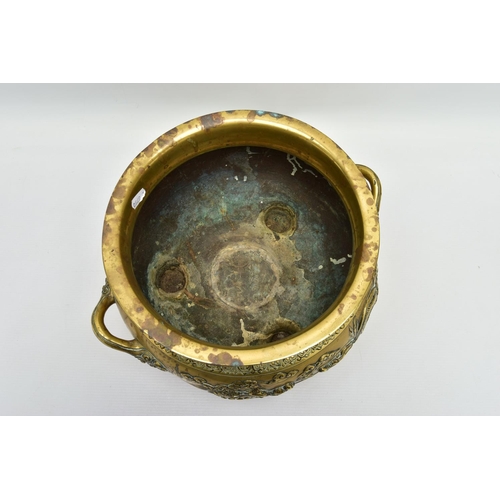 277 - A CHINESE BRASS TWIN HANDLED TRIPOD CENSER OF CIRCULAR FORM, cast in relief with four dragons, the i... 