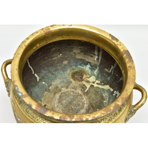 277 - A CHINESE BRASS TWIN HANDLED TRIPOD CENSER OF CIRCULAR FORM, cast in relief with four dragons, the i... 