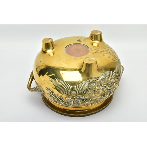 277 - A CHINESE BRASS TWIN HANDLED TRIPOD CENSER OF CIRCULAR FORM, cast in relief with four dragons, the i... 