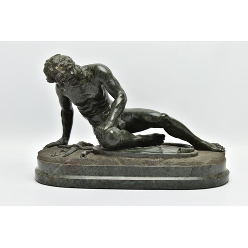 278 - A 19TH CENTURY CARVED SERPENTINE FIGURE OF THE DYING GAUL, AFTER THE ANTIQUE, on an integral oval pl... 