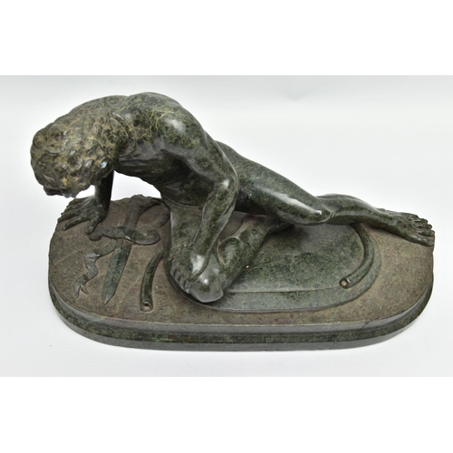 278 - A 19TH CENTURY CARVED SERPENTINE FIGURE OF THE DYING GAUL, AFTER THE ANTIQUE, on an integral oval pl... 