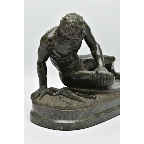 278 - A 19TH CENTURY CARVED SERPENTINE FIGURE OF THE DYING GAUL, AFTER THE ANTIQUE, on an integral oval pl... 