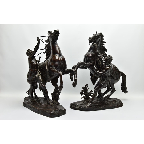 279 - AFTER GUILLAME COUSTEAU, A 19TH CENTURY PAIR OF PATINATED BRONZE MARLY HORSES, with attendants, on n... 