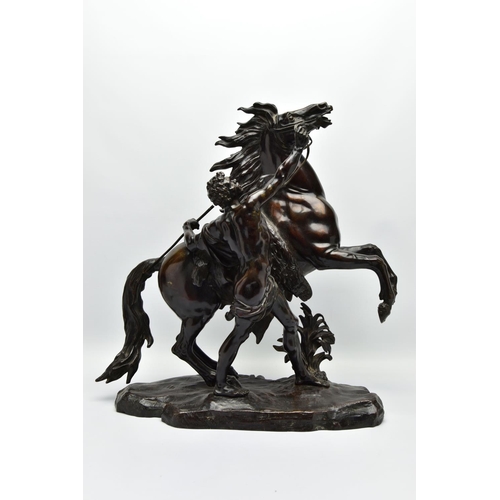 279 - AFTER GUILLAME COUSTEAU, A 19TH CENTURY PAIR OF PATINATED BRONZE MARLY HORSES, with attendants, on n... 