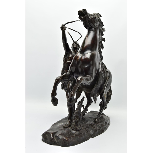 279 - AFTER GUILLAME COUSTEAU, A 19TH CENTURY PAIR OF PATINATED BRONZE MARLY HORSES, with attendants, on n... 