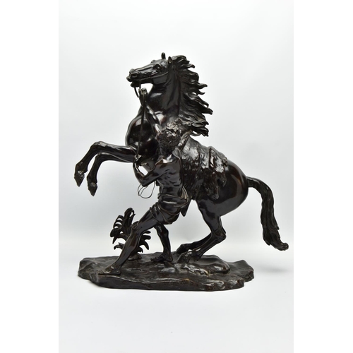 279 - AFTER GUILLAME COUSTEAU, A 19TH CENTURY PAIR OF PATINATED BRONZE MARLY HORSES, with attendants, on n... 