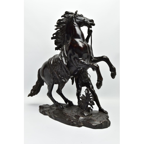 279 - AFTER GUILLAME COUSTEAU, A 19TH CENTURY PAIR OF PATINATED BRONZE MARLY HORSES, with attendants, on n... 