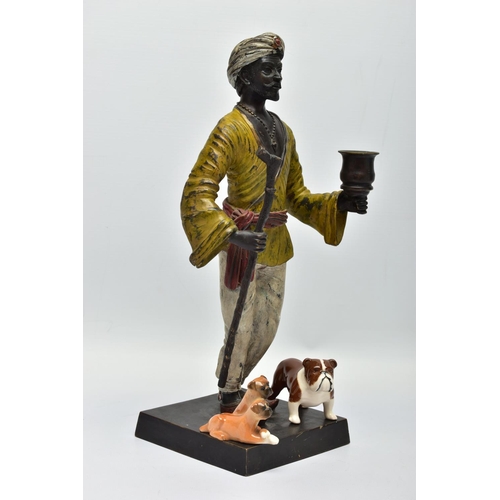 280 - A 2OTH CENTURY COLD PAINTED AND PATINATED BRONZE CANDLE HOLDER IN THE FORM OF A MIDDLE EASTERN MAN, ... 