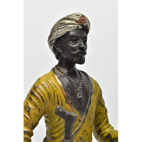 280 - A 2OTH CENTURY COLD PAINTED AND PATINATED BRONZE CANDLE HOLDER IN THE FORM OF A MIDDLE EASTERN MAN, ... 