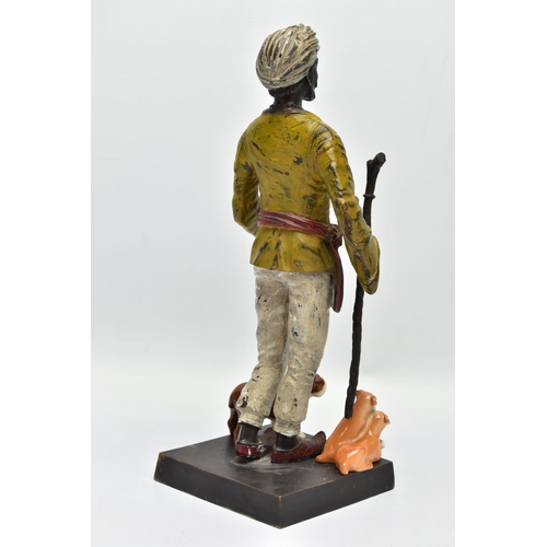 280 - A 2OTH CENTURY COLD PAINTED AND PATINATED BRONZE CANDLE HOLDER IN THE FORM OF A MIDDLE EASTERN MAN, ... 