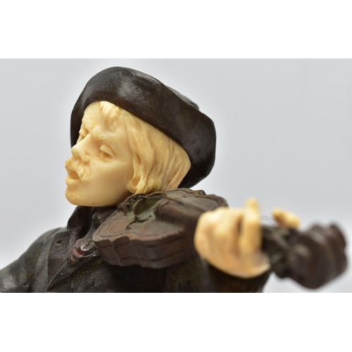 294 - DOMINIQUE ALONZO (FL. 1910-1930) A PATINATED BRONZE AND IVORY FIGURE OF A MALE VIOLINIST, posed stan... 