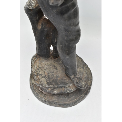 314 - A LATE 19TH / EARLY 20TH CENTURY CAST LEAD GARDEN FIGURE OF A BOY PLAYING A FLUTE, standing on a cir... 