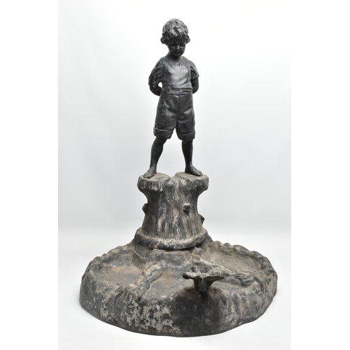 315 - AN EARLY 20TH CENTURY HOLLOW CAST LEAD FIGURAL BIRD BATH, modelled as a boy standing on a tree trunk... 