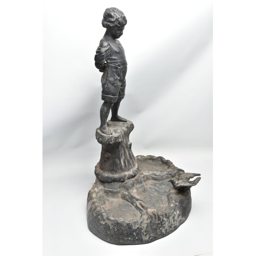 315 - AN EARLY 20TH CENTURY HOLLOW CAST LEAD FIGURAL BIRD BATH, modelled as a boy standing on a tree trunk... 