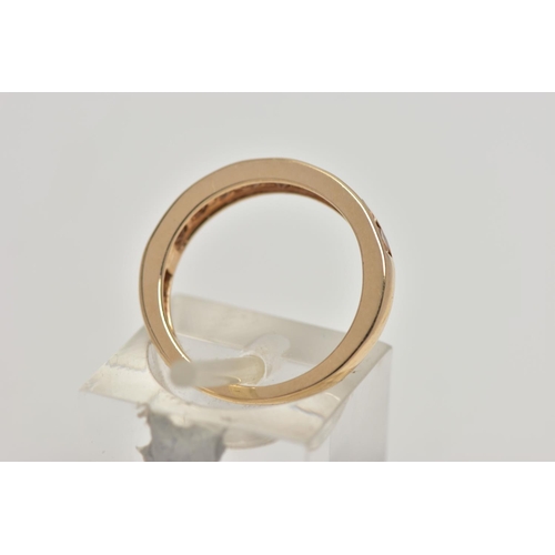 106 - A 9CT GOLD GEM SET HALF ETERNITY RING, the circular shape peachy colour gems assessed as tourmaline,... 