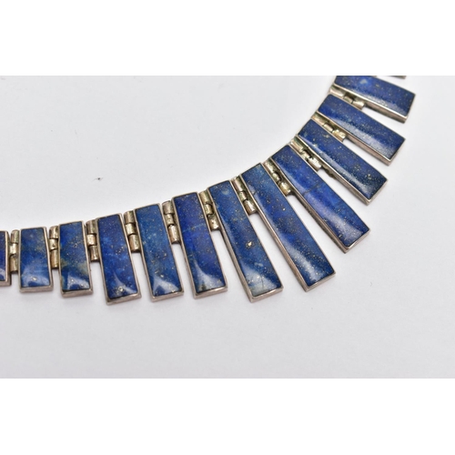 107 - A WHITE METAL LAPIS LAZULI FRINGE NECKLACE, designed as a series of graduated lapis lazuli hinged pa... 