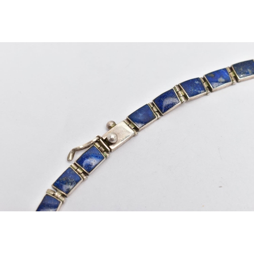 107 - A WHITE METAL LAPIS LAZULI FRINGE NECKLACE, designed as a series of graduated lapis lazuli hinged pa... 