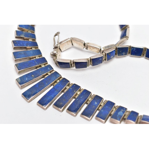 107 - A WHITE METAL LAPIS LAZULI FRINGE NECKLACE, designed as a series of graduated lapis lazuli hinged pa... 