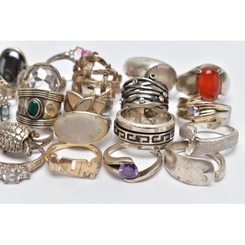 118 - A BAG OF SILVER AND WHITE METAL RINGS, to include a silver Greek key pattern band with swivel centre... 