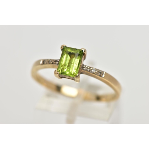 12 - A 9CT GOLD PERIDOT AND DIAMOND DRESS RING, the rectangular shape peridot, within a claw setting, to ... 